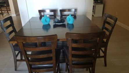 Dark tone High dining table ,upholsterd 24" Barstool..