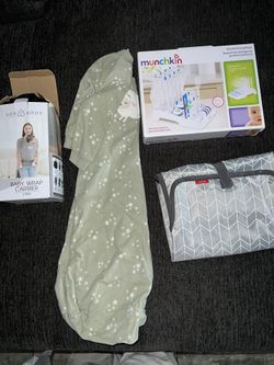 Baby Carrier, Pjs , Changing Mat, Bottle Rack 