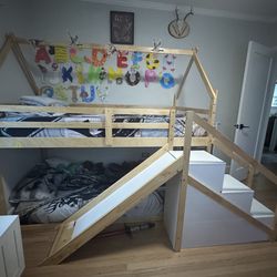 Wooden bunk bed with slide and step storage