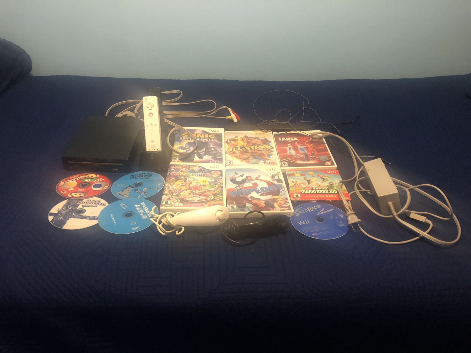 Wii with 10 games, 2 controllers, 2 nunchucks, charger for 2 controllers, and including all wires