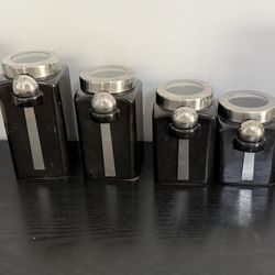 Set of 4 Ceramic canisters with spoons