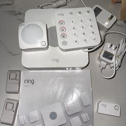  Complete Ring Alarm home security system including base station, keypad, motion detector, contact sensors, range extender, power adapters, and manual