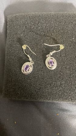 They are amethyst and sterling silver dangle earrings.