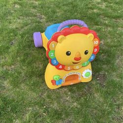 Fisher price lion ride on and walker 