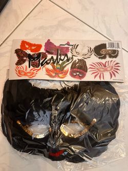 Eyes Wide Shut Black Feather Mask with red and gold accents