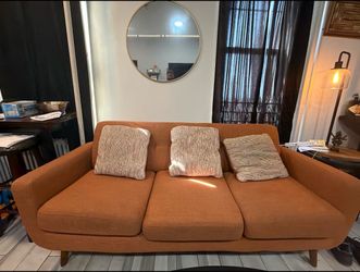 Cozy Orange Couch for sale