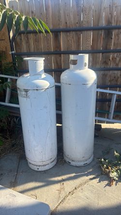 Two  100 lbs propane tanks