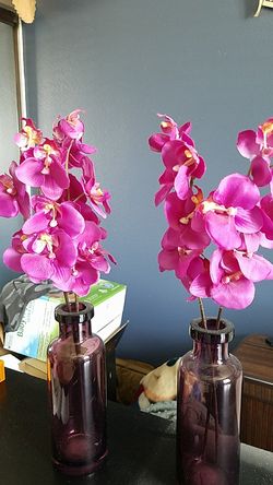 Purple vase and fake flowers