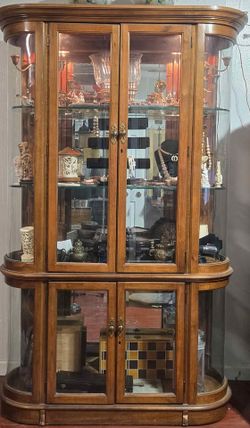 Cabinet 4 door oak curio with beveled glass and lighting by Pulaski Furniture