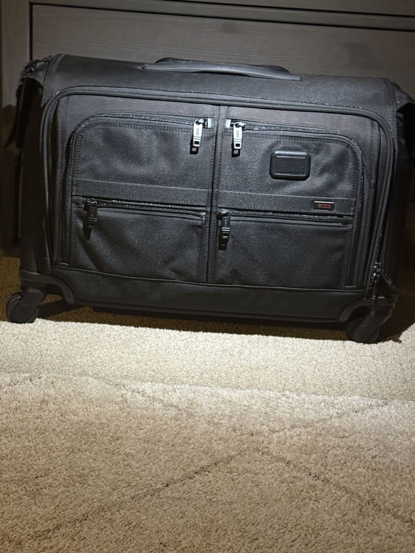 never used TUMI 4 Wheel Rolling garnet Bag