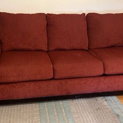 Red cloth pull out couch / futon