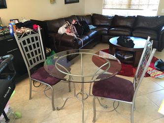 Glass table with two chairs