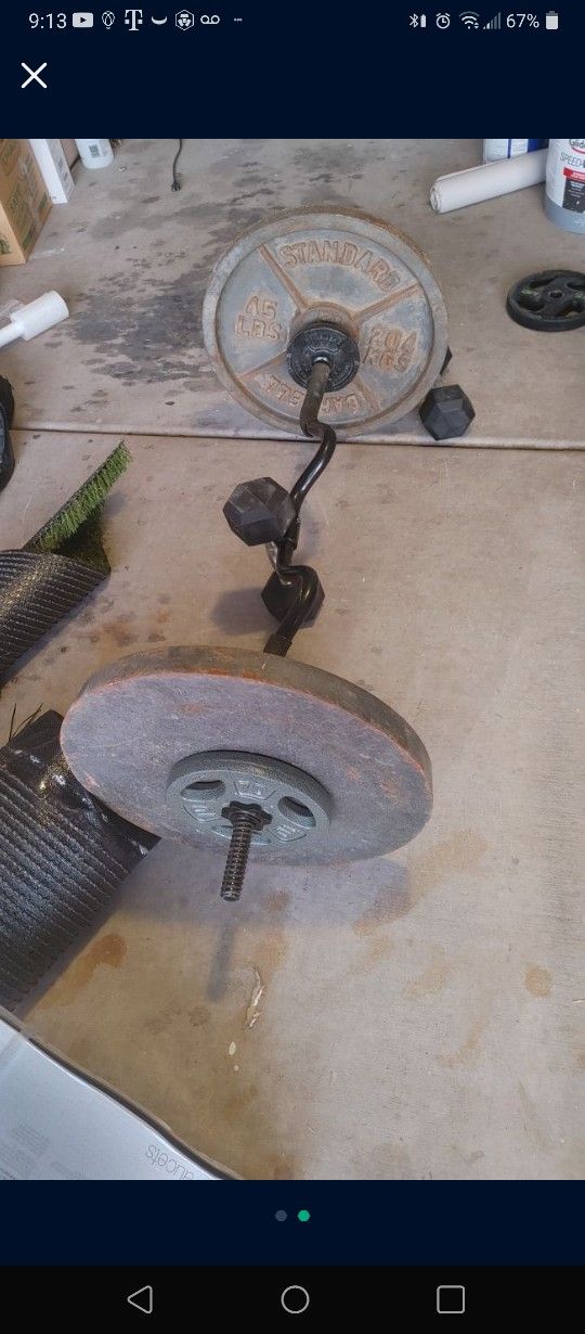 Squat Rack, Bench Press And 200ib Weights.
