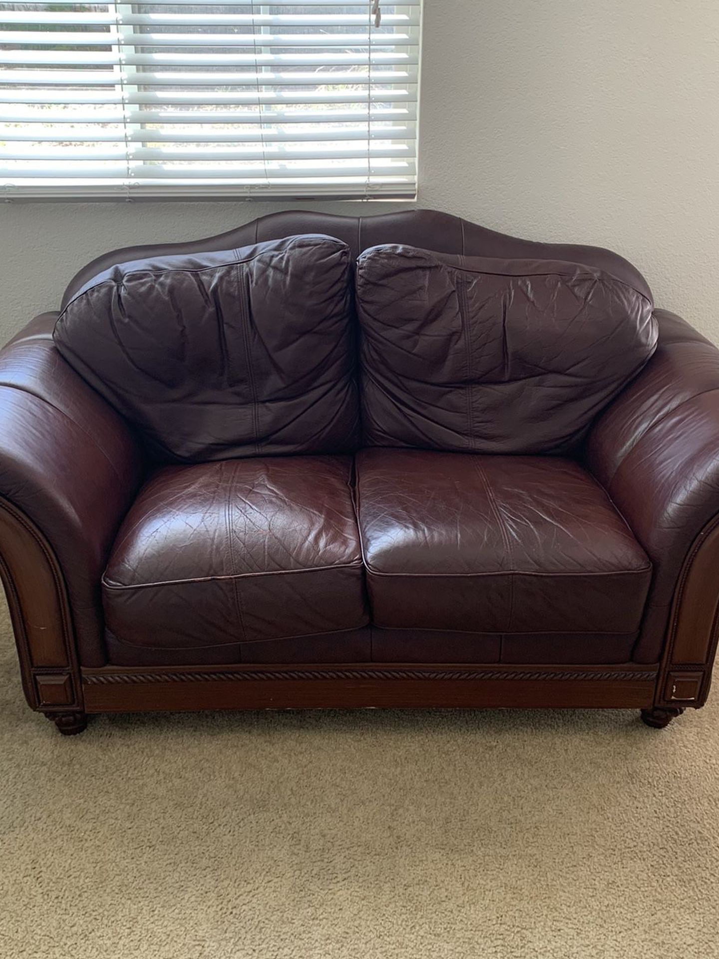 Beautiful Wine Red Leather Love Seat.