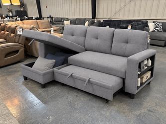 Sleeper sectional sofa with pullout bed, storage chase, and USB charging ports Sleeper sectional sofa with pullout bed, storage chaise, & USB charging