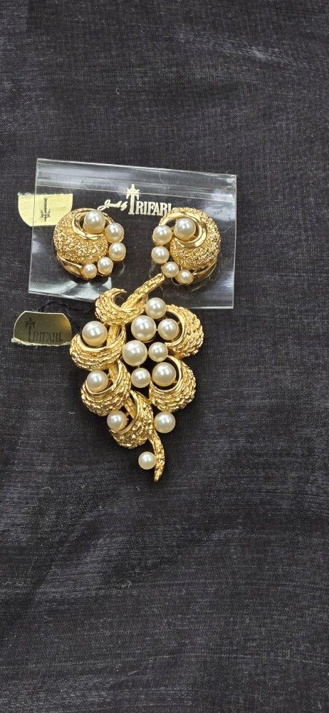 Trifari earrings and a brooch With Tags Attached