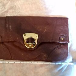 Gorgeous Brown Leather Clutch with gold closure.