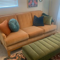 Carmel Colored Velvet Sofa and Green ottoman And Floral Rug 