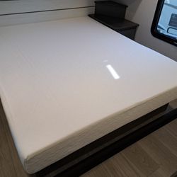 Brand new, unused Queen size mattress, bedspread and platform from an RV.