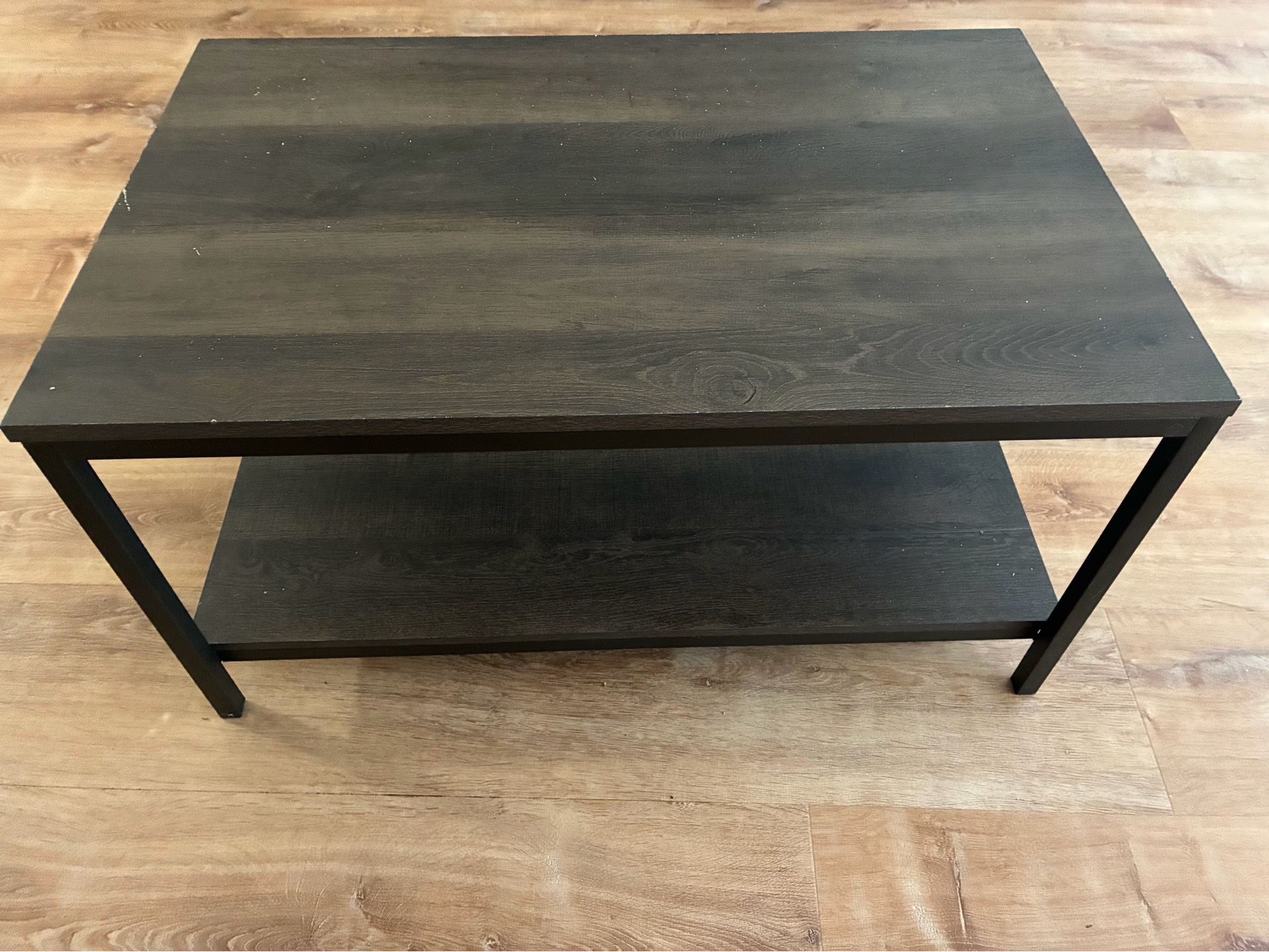 Coffee table - rectangle table with brown/black coloring and a wood/metal frame