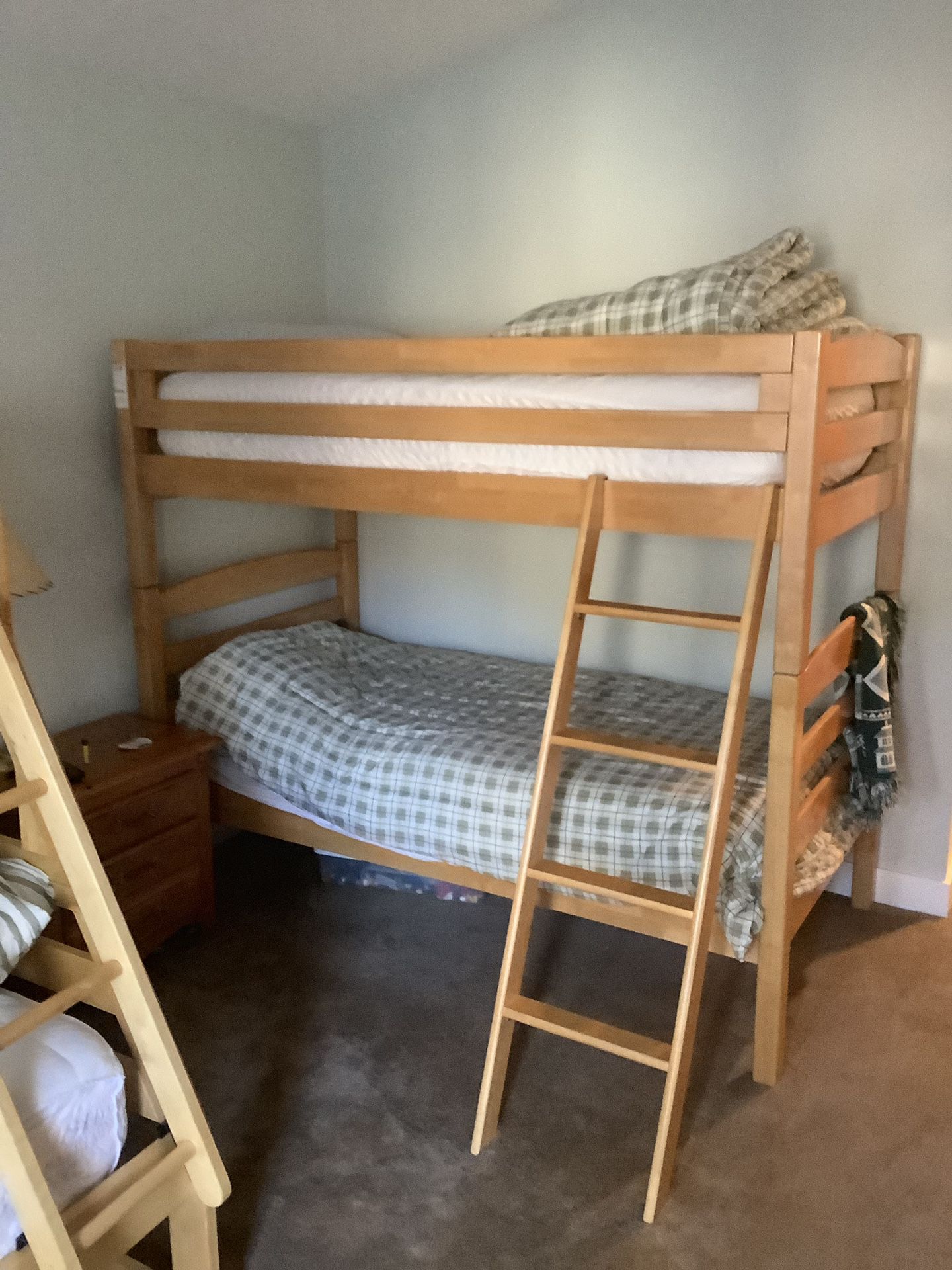 One Bunk bed frame with mattresses and bedding...