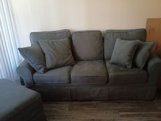 Grey couch with ottoman for storage