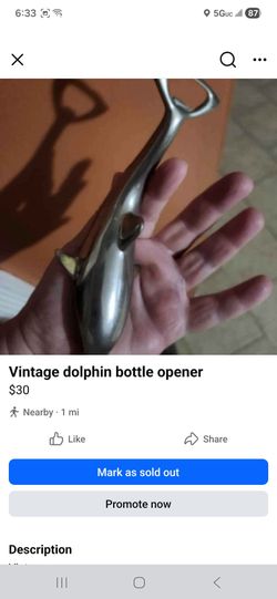 Vintage dolphin bottle opener
