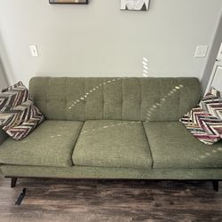 green sofa + 2 pillows 