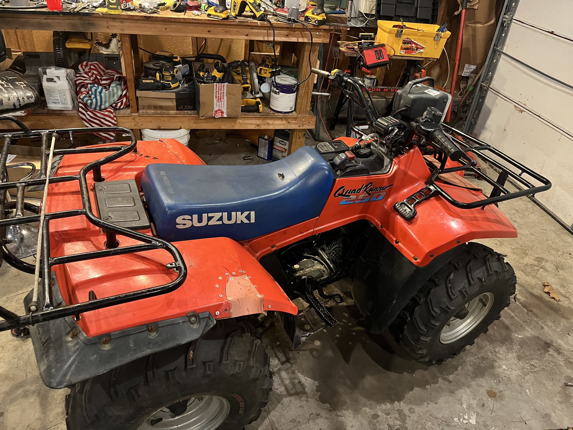 198? Suzuki 250 quad Runner five speed with reverse low high gear, semi automatic transmission.
