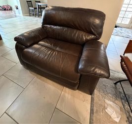 2 recliner leather couches