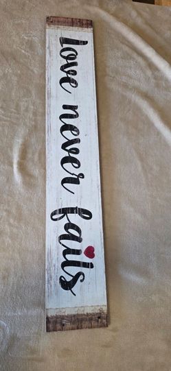 Love Never Fails wall Rustic Wood Sign