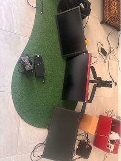 Two ViewSonic monitors and one AOC gaming monitor with adjustable desk mount and dell docking station included