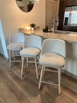 Three Matching Swivel Barstools