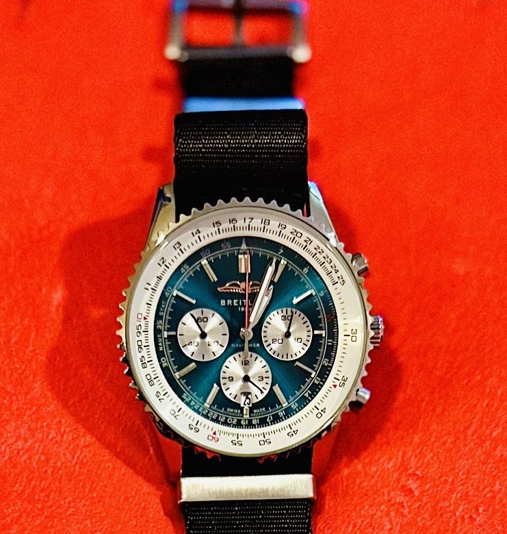Breitling Navitimer with a striking blue-green dial with contrasting silver sub-dials