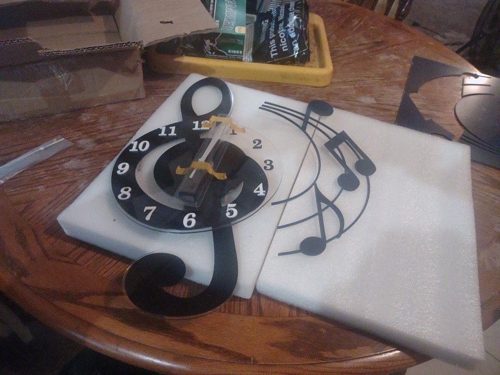 Treble Clef With Swinging Pendulum Quarts Wall Clock.