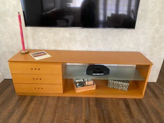 For sale pre-owned custom made mid-century modern style sideboard or media console, featuring solid blonde wood finish .