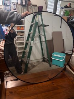 Black large oval wall mirror