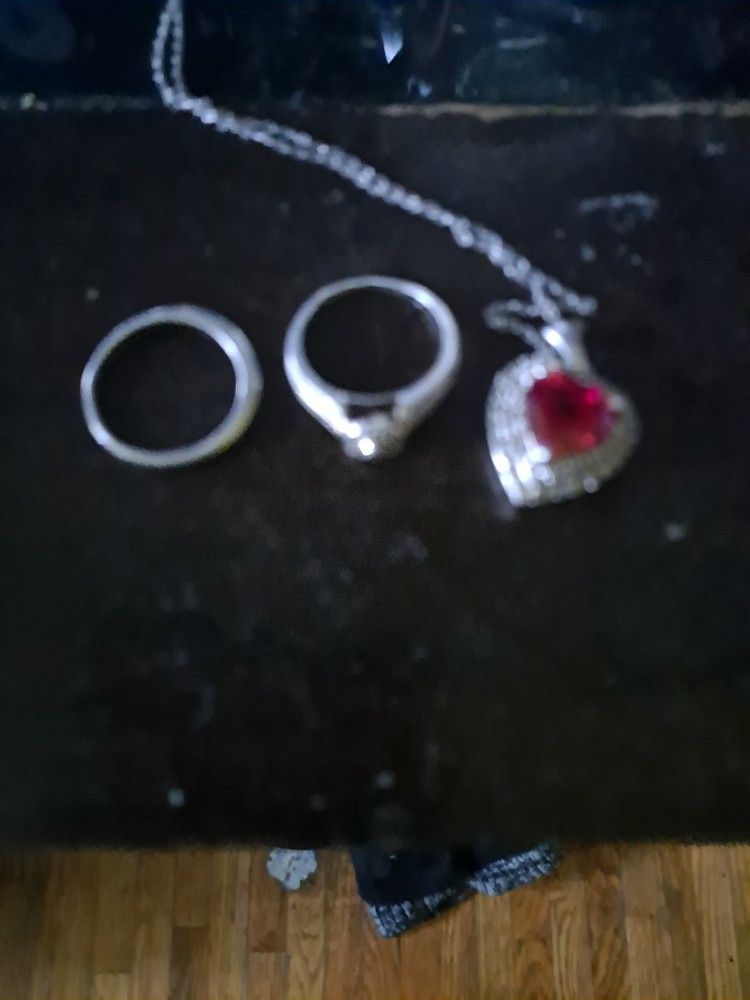 Engagement Ring And Band And Heart Necklaces