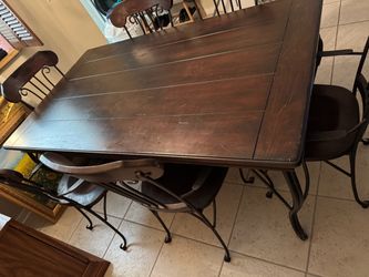 Wooden table with six chairs