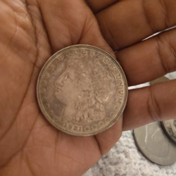 This item is a 1921 Morgan silver dollar, a famous American collectible coin composed of 90% silver and 10% copper. In circulation.