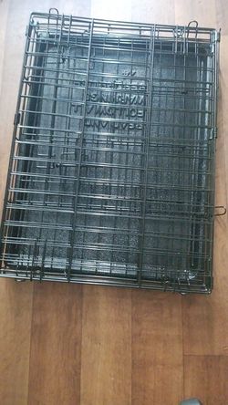 Foldable dog cage with tray