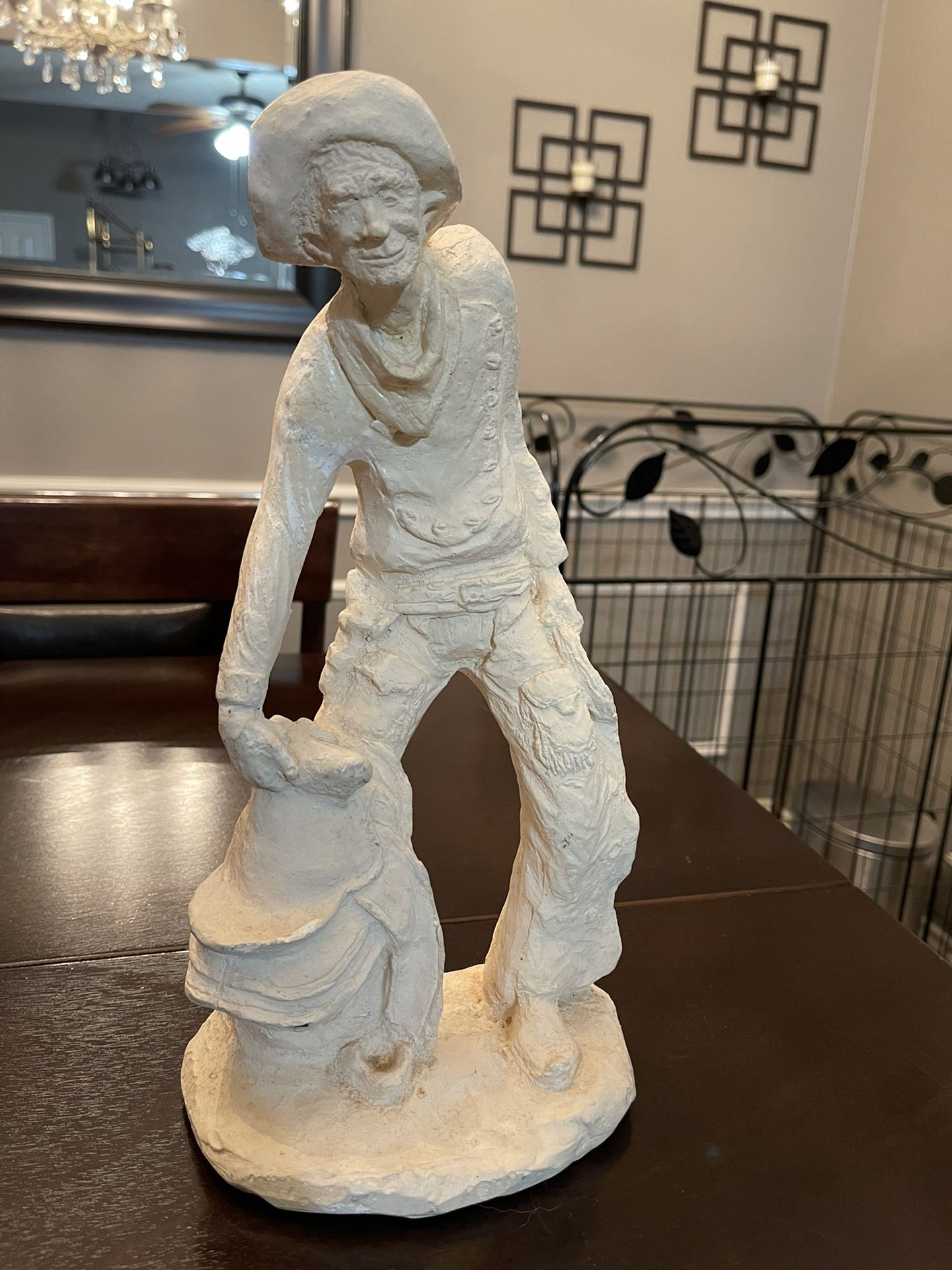 Cowboy statue with saddle