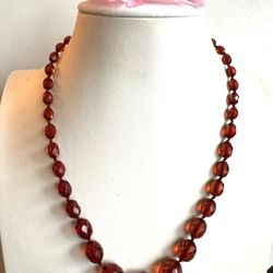 vintage and gorgeous hand knotted and faceted Amber bakelite necklace 18”inch