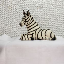 House of global art #H588B83 porcelain Zebra figurine  from Japan.  Measures 4 1/2" T X 5 3/4" L X 2 1/2" W . Good condition and smoke free home. 