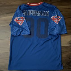 SUPERMAN Logo Football Jersey DC Comics Size Adult Med RUNS LIKE A LARGE