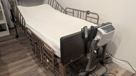 Electric hospital bed w/ self leveling air mattress thing