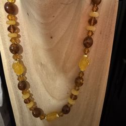 Multi colored amber/yellow tones and shaped resin beaded necklace 24” length  