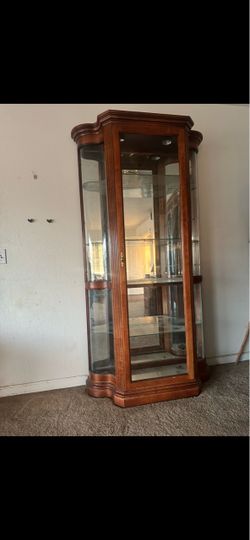 Thin tall curio cabinet