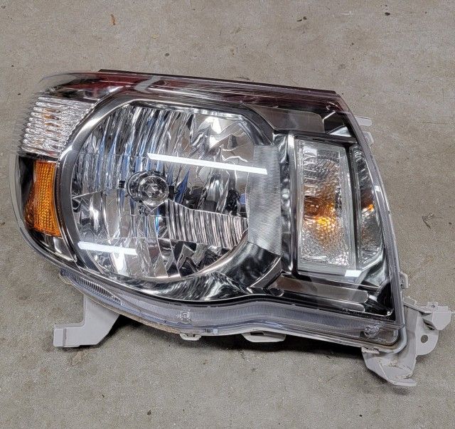 Toyota Tacoma 2005-2011 TRD Sport headlight. OEM. Right side