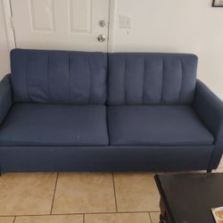 A Blue Pull-out Bed Couch